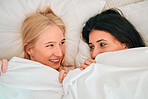 Love, above and lesbian couple in bed, waking up and bonding in their home together. Lgbt, gay and happy women sharing romance, relationship and sweet moment in a bedroom, in love and content