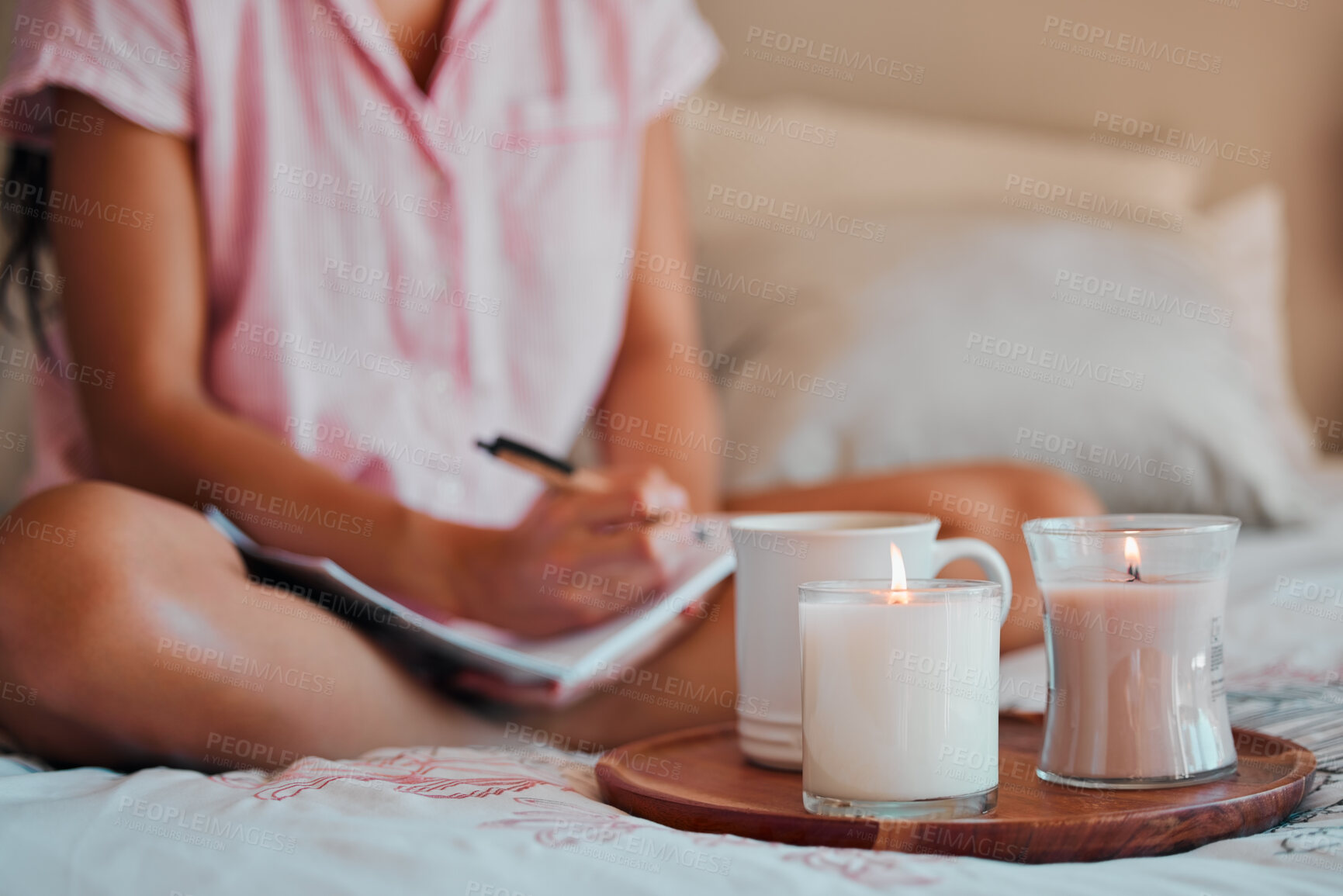 Buy stock photo Notebook, writing and woman with home candles for healing journal, calm planning or self care inspiration in bedroom. Creative person or writer for mindfulness goals, meditation or peace notes in bed