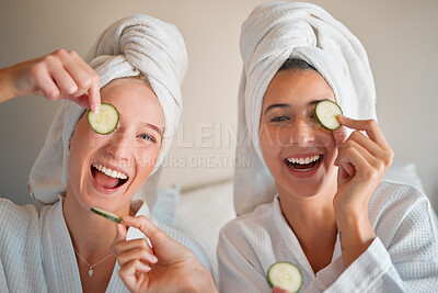 Buy stock photo Friends, cucumber and teenager, girl and facial, happy with pampering and beauty in portrait with skincare treatment. Happiness, people have fun together and female friendship, cosmetics and laughter