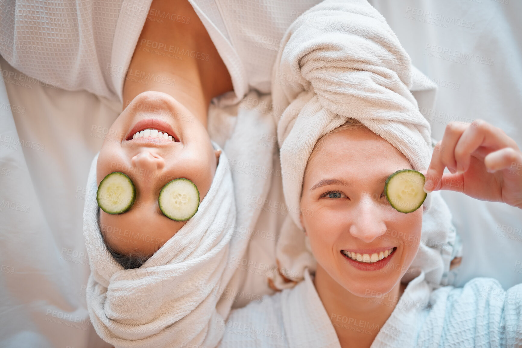 Buy stock photo Friends, face and teenager, girl and facial, pampering and beauty, cucumber in portrait for skincare treatment. Happiness, people have fun together and female friendship, cosmetic care and top view