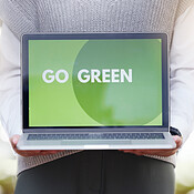 Closeup, laptop and go green for sustainability, eco friendly and ...