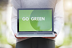 Closeup, laptop and go green for sustainability, eco friendly and conservation for the planet. Recycle, technology and global message for responsibility, carbon footprint and clean energy with screen