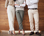 Standing, office and legs of business people with arms crossed for an interview, meeting or teamwork. Together, corporate and employees at work for success, collaboration or group solidarity