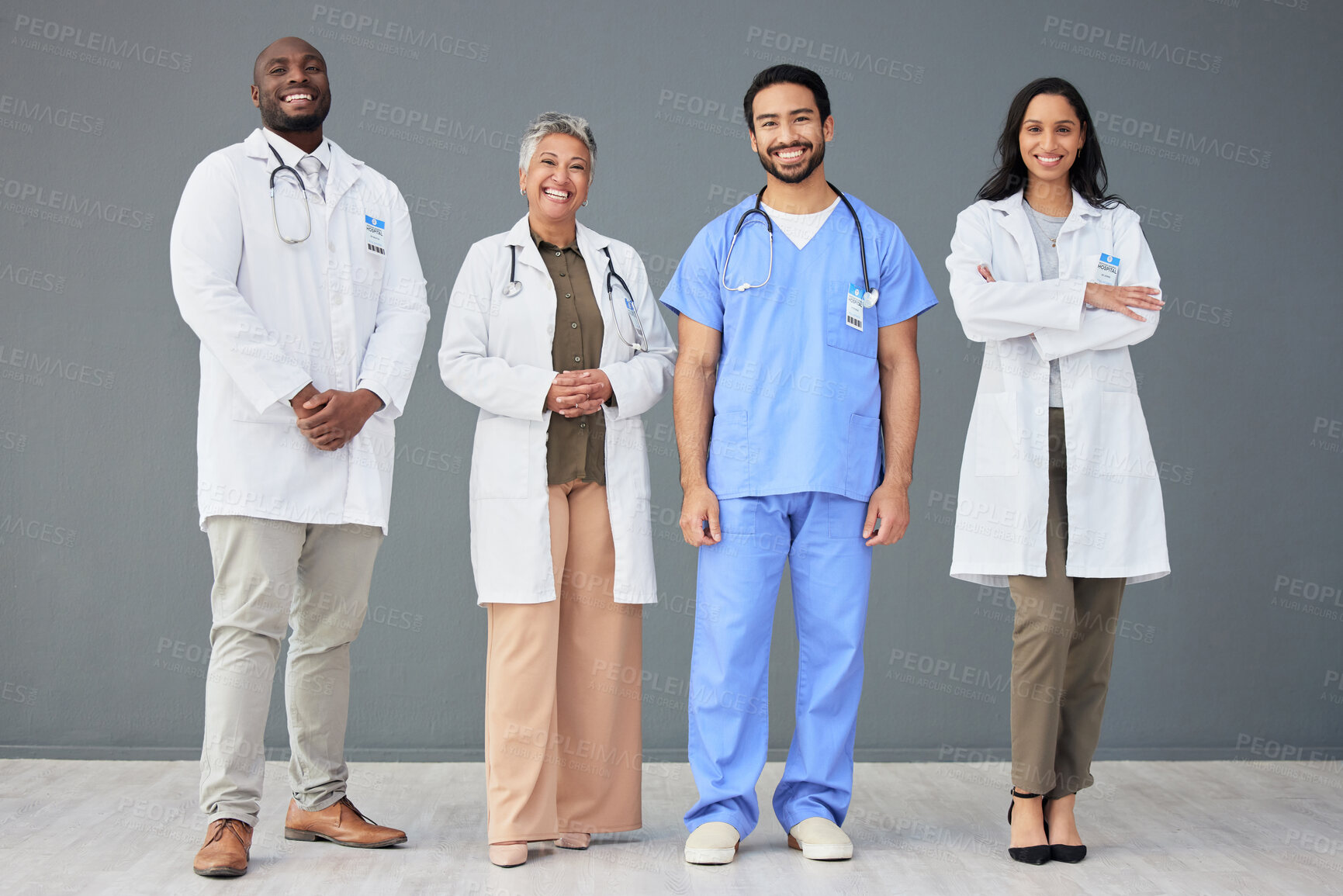 Buy stock photo Hospital, doctors and portrait of people on wall background for insurance, wellness and medical service. Healthcare, teamwork and men and women standing in line for consulting, group and diversity