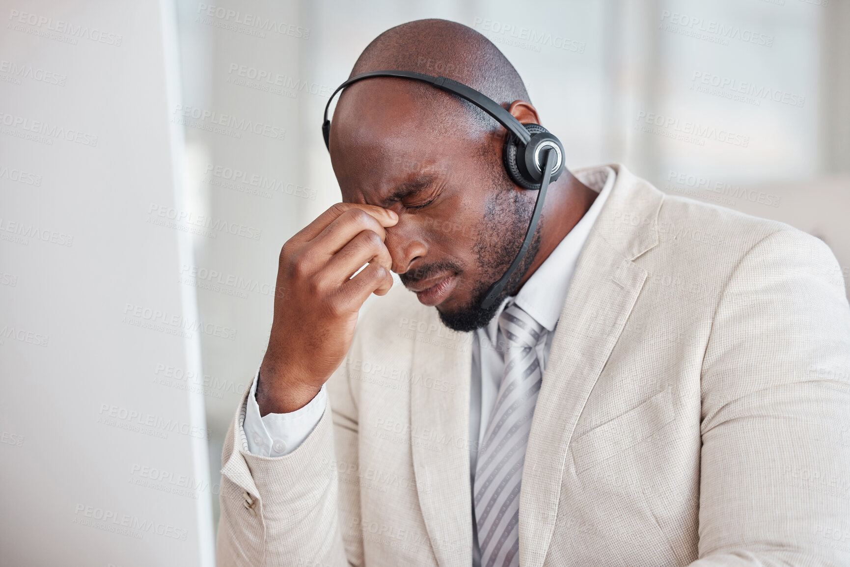 Buy stock photo Tired call center man with headache, fatigue and pain on computer customer support, telecom working or virtual help desk. Burnout agent, stress consultant or african person with migraine at office