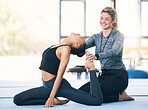 Exercise, fitness and woman with happy personal trainer at a gym for training, balance and wellness. Athlete female with coach person for support and help with legs for gymnastics, pilates or yoga