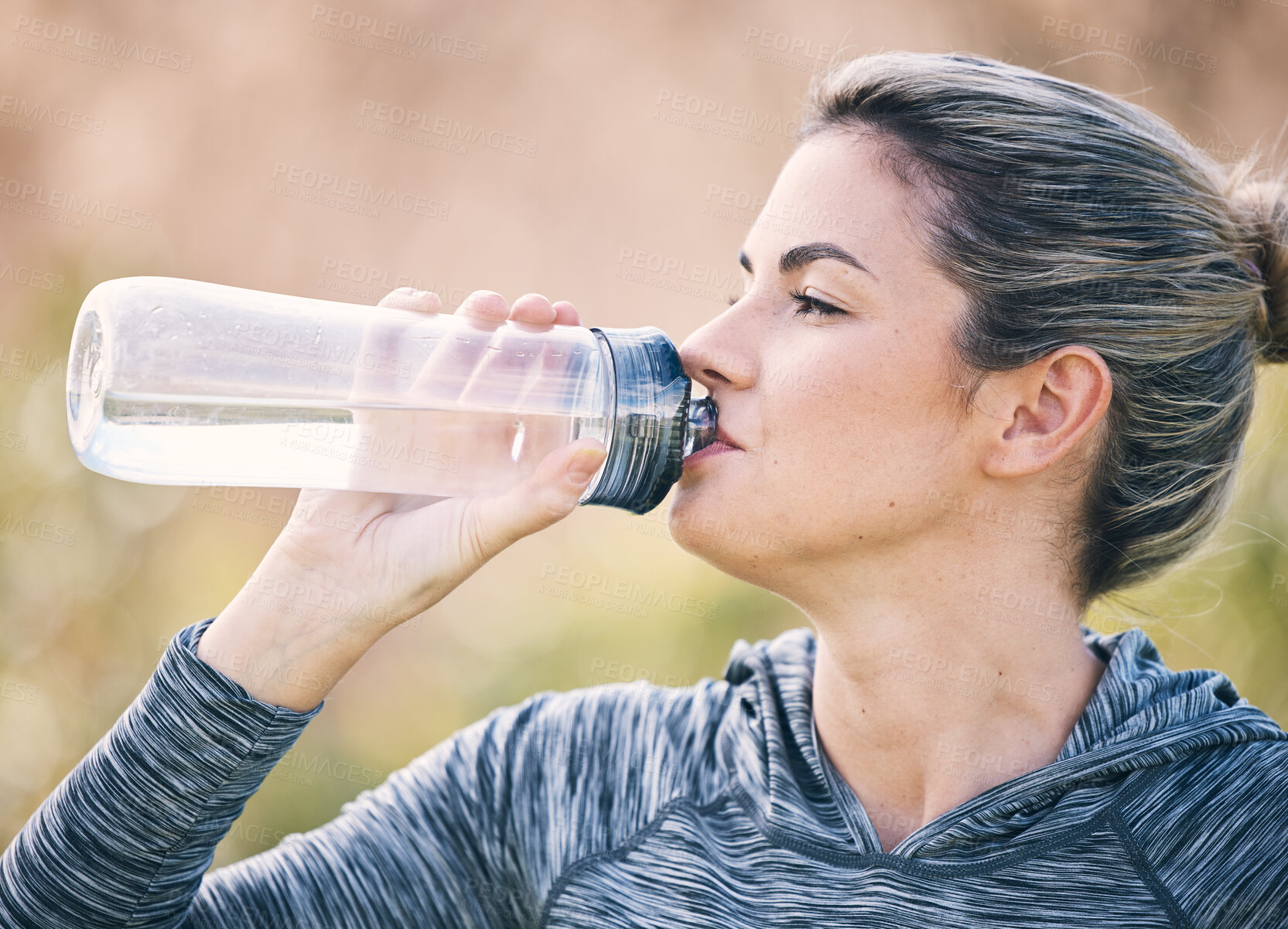 Buy stock photo Woman drinking water at park for health, break and energy for workout, training and diet. Thirsty female, bottle and fitness nutrition for hydration, sports wellness and muscle recovery from exercise