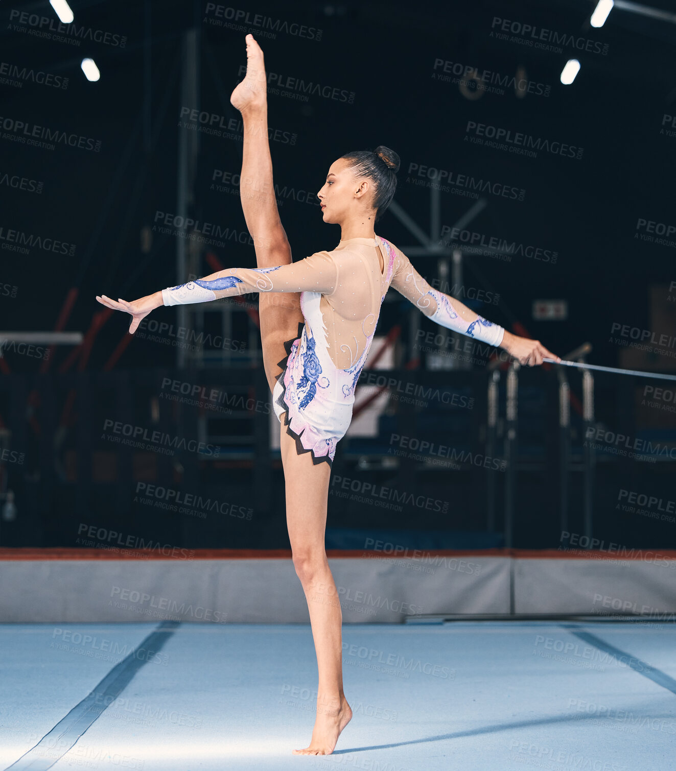 Buy stock photo Ribbon, gymnastics and flexible woman in dance performance, balance legs and sports competition. Female, rhythmic movement and flexible dancing athlete, action and talent of creative concert in arena