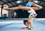 Woman, gymnastics and ball for flexible performance, body balance and dancer in sports arena. Female, rhythmic movement and dancing upside down for creative talent, solo concert and agility challenge