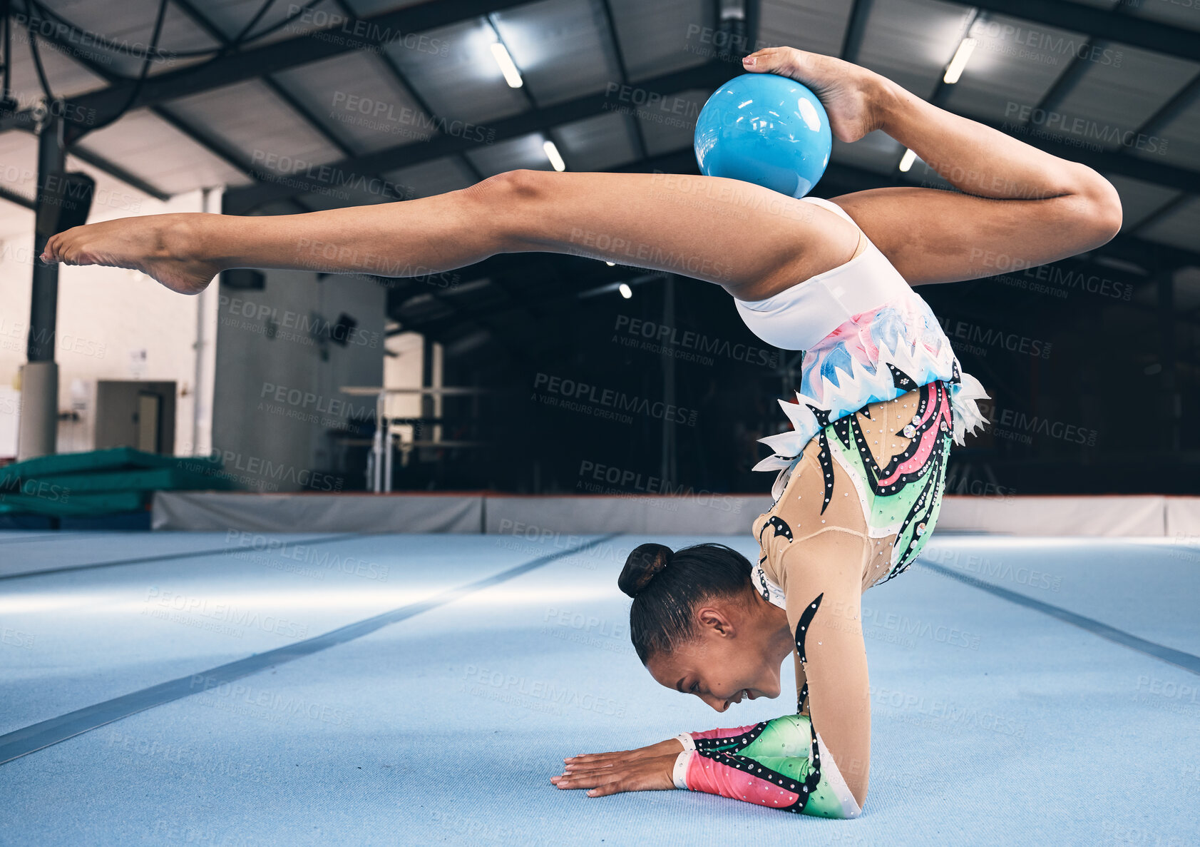 Buy stock photo Woman, gymnastics and ball for flexible performance, body balance and dancer in sports arena. Female, rhythmic movement and dancing upside down for creative talent, solo concert and agility challenge