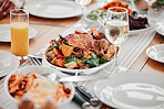 Food, dinner and party with drinks and table setting, celebration and holiday with Christmas or thanksgiving. Social event, gathering and wine, chicken and juice with gourmet meal, festive and feast