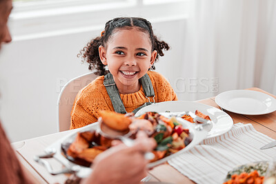 Buy stock photo Family dinner, child and mother with vegetables serving at a home table with happiness on holiday. Food, house and happy eating of a girl with a smile at a gathering with a kid and mom at meal