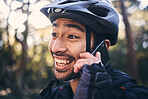 Sports, face of man and phone call outdoor for cycling, mountain bike or workout and smile in nature. Male person in forest with smartphone for communication, contact or talking fitness with helmet