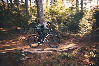 Buy stock photo Man, outdoor and cycling in nature for sports, exercise or training on a mountain bike with speed. Athlete male person on a bicycle for a fitness workout for energy in a forest with green trees