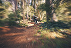 Bike, cycling and motion blur with a man in nature for fitness, adventure or freedom in the forest. Bicycle, exercise and a male athlete cyclist outdoor in the woods for cardio or endurance training