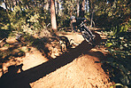 Fitness, bicycle and man outdoor on a forest path with extreme and exercise adventure. Bike, cycling and sport of an athlete with fast speed and nature cycle for sports training and race action