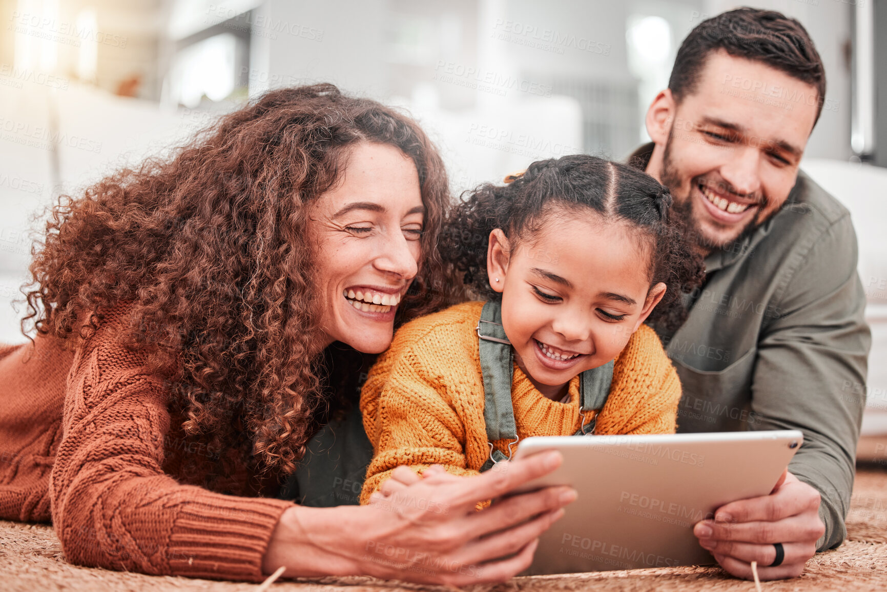 Buy stock photo Happy family on floor with tablet, kid and movies, streaming service for child development video for education. Mom, dad and girl on carpet, happiness and smile, digital entertainment in living room.