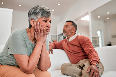 Buy stock photo Divorce, stress and senior couple in home living room on sofa with conflict, infidelity or cheating. Retirement, elderly and man and woman fighting, sad or depressed with marriage problem or thinking