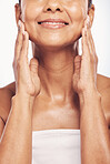 Hands, facial and skin with a mature woman in studio for beauty, anti aging treatment or cosmetics. Skincare, mouth and wellness with a senior female moisturizing her face for hydration closeup