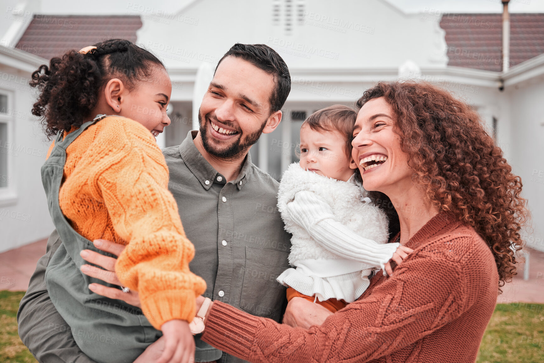 Buy stock photo Happy, home and family outdoor, bonding and quality time for memories, real estate or cheerful together. Parents, mother or father with children, kids in backyard or happiness with joy or interracial