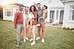 Family, generations and happiness in portrait outdoor, grandparents and parents with children on lawn at home. Men, women and kids, love and care in relationship with smile and happy people at house