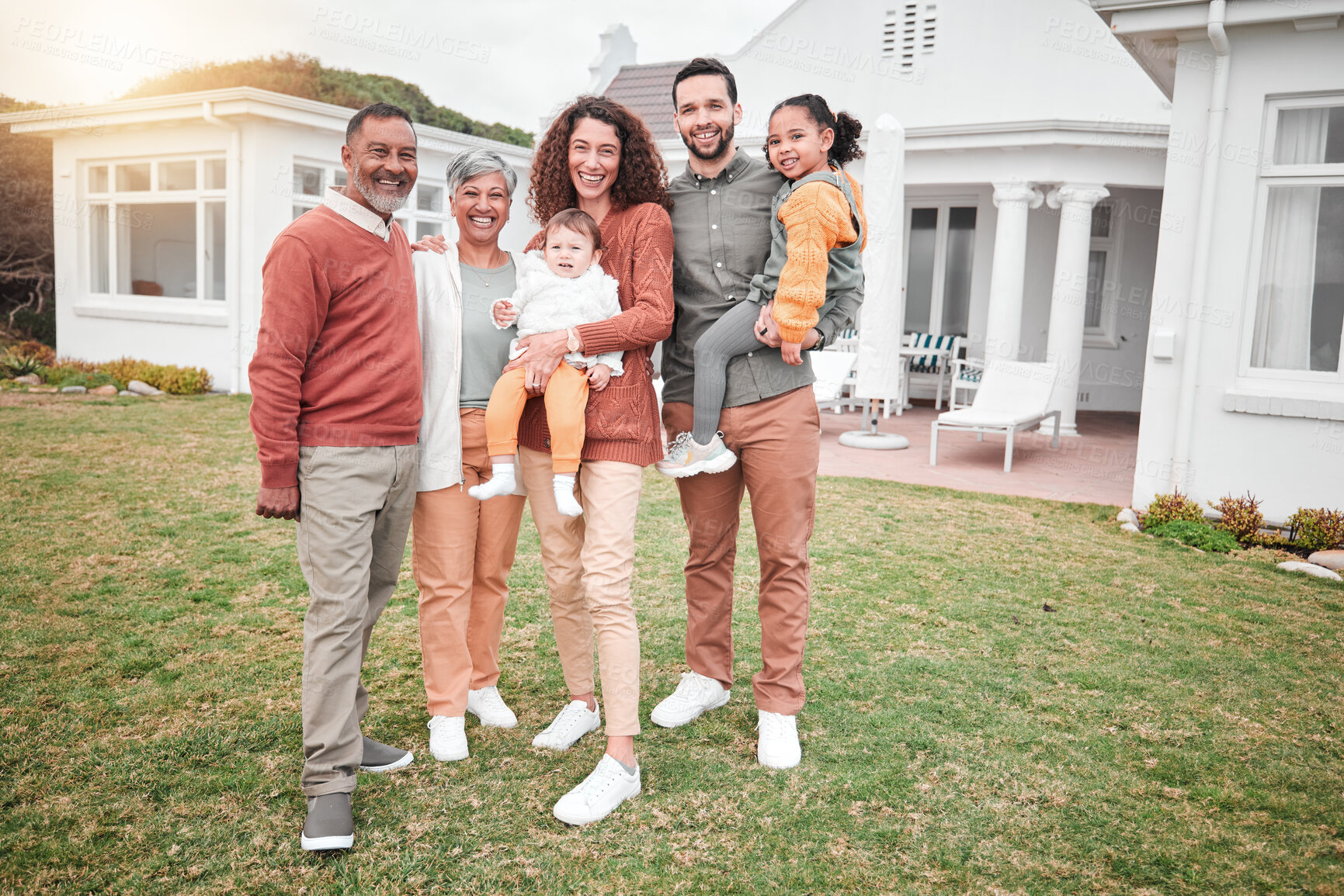 Buy stock photo Family, generations and happiness in portrait outdoor, grandparents and parents with children on lawn at home. Men, women and kids, love and care in relationship with smile and happy people at house