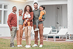 Family, generations and happy in portrait outdoor, grandparents and parents with children at holiday home. Men, women and kids, love and care in relationship with smile and people on vacation