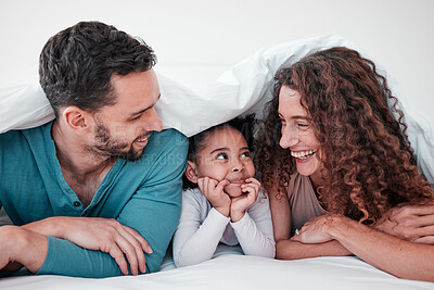 Buy stock photo Family, parents are happy with child in bed and relax under blanket in bedroom with smile, love and care. Spending  time together, bonding and happiness, man and woman with young girl at home