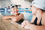 Sports women, relax or friends in swimming pool on break in training, workout or exercise for wellness. Healthy athlete swimmers, smile or happy girls speaking, talking or bonding in fitness together