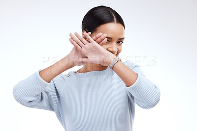 Buy stock photo Stop, hands and woman portrait in a studio showing palm and hiding with protest. Isolated, white background and shy female with emoji hand gesture for protection and defense icon for reject