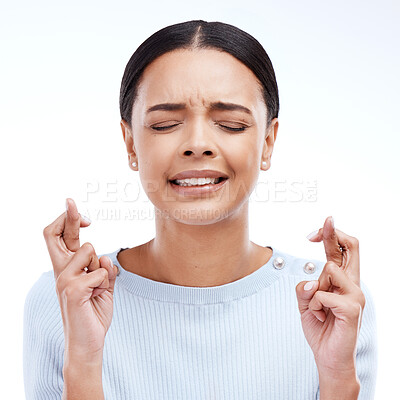 Buy stock photo Fingers crossed, hope and woman thinking for luck in a studio with wish. Motivation, waiting and hands optimism emoji of a young female ready for winning and lottery prize with white background
