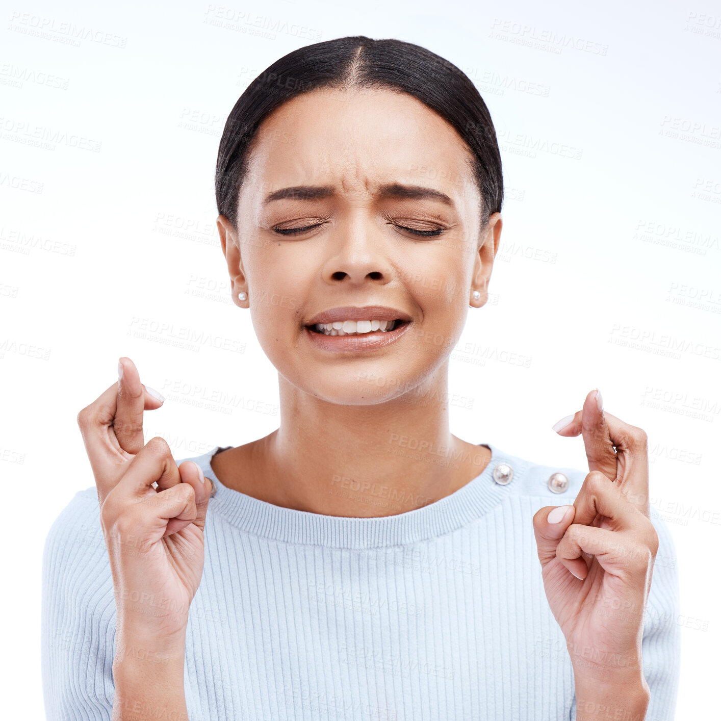 Buy stock photo Fingers crossed, hope and woman thinking for luck in a studio with wish. Motivation, waiting and hands optimism emoji of a young female ready for winning and lottery prize with white background