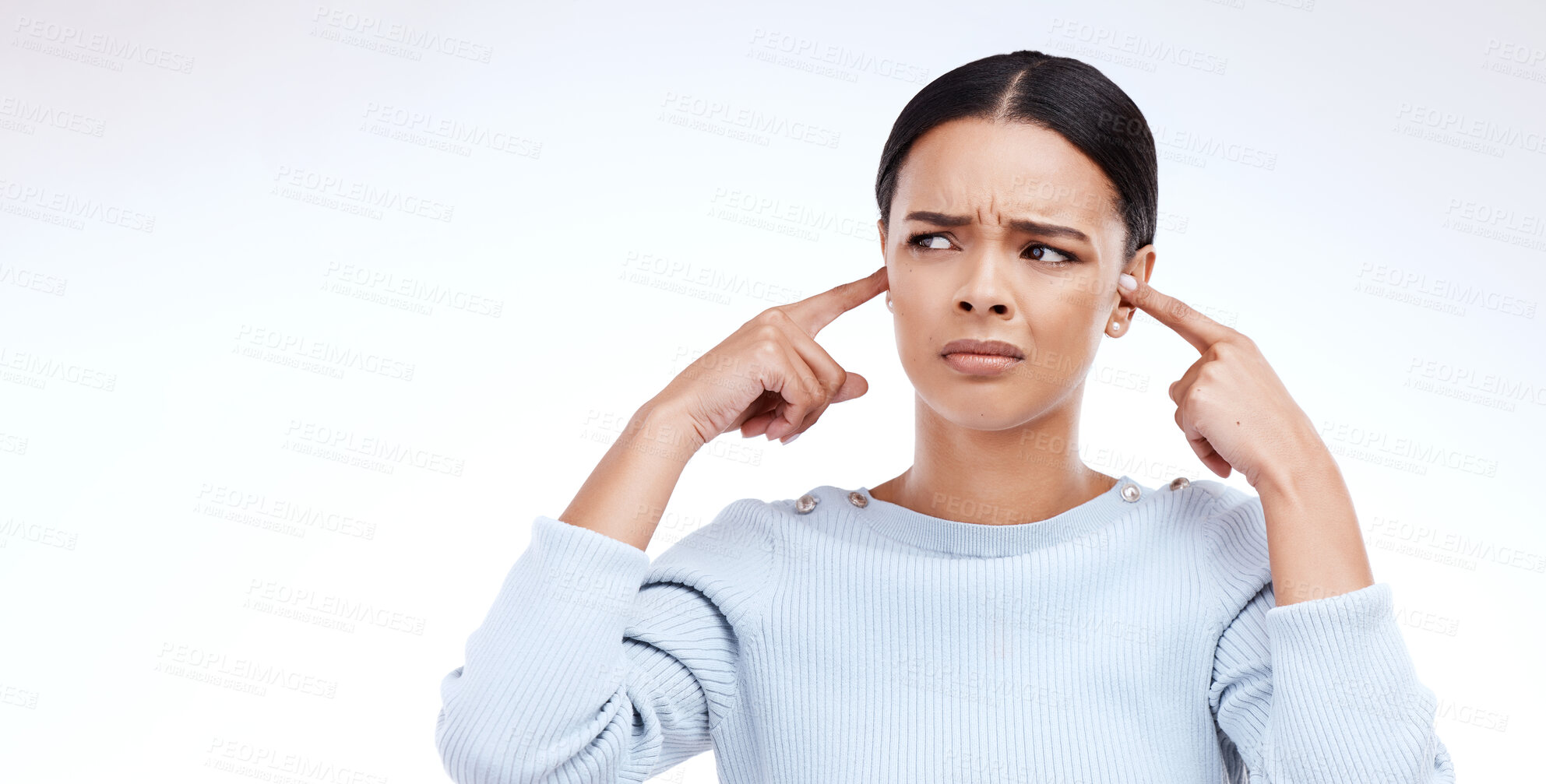 Buy stock photo Annoyed, woman and finger in ears for noise, loud and denial gesture on studio white background. Omg, face and angry girl with complaint, ignoring and deaf, wtf and emoji, frustrated and unhappy