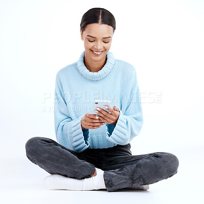 Buy stock photo Happy, woman and typing on smartphone, white background and isolated studio for social media post. Female model texting on cellphone, download mobile app games and search digital network on floor 