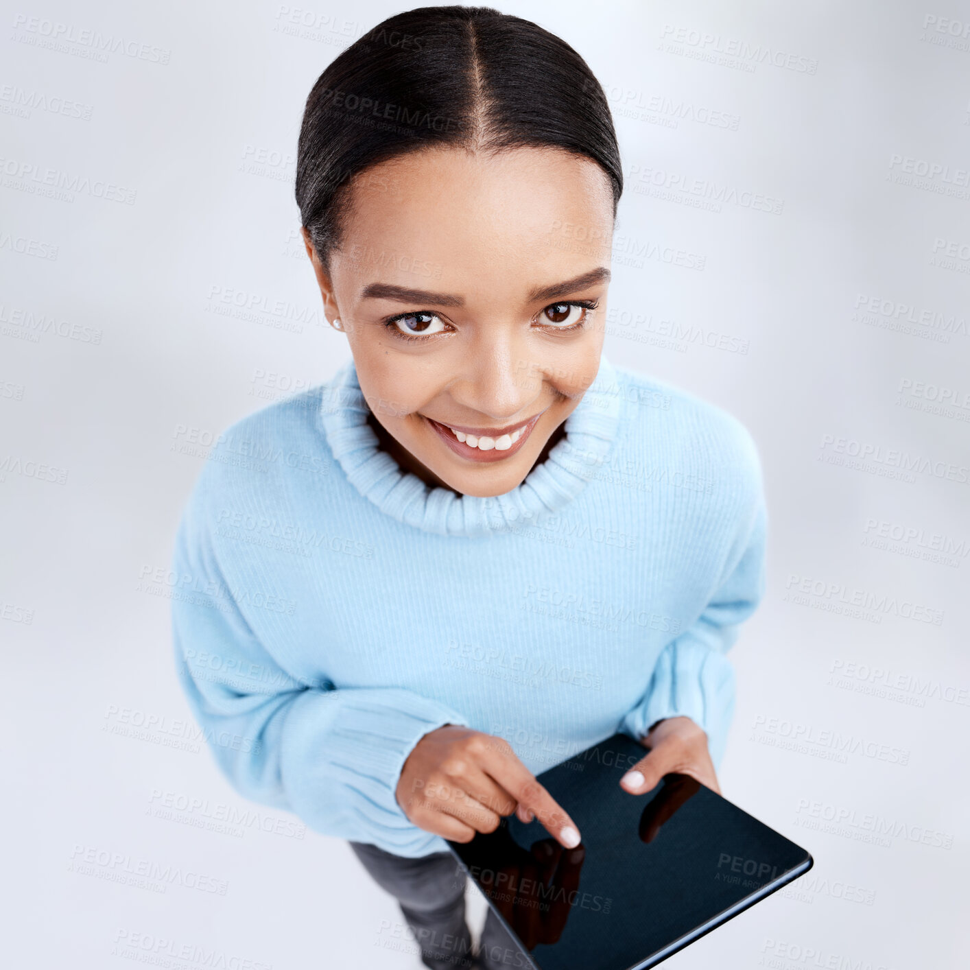Buy stock photo Top view, tablet screen and portrait of studio woman on isolated white background and pressing for internet connection. Smile, face and POV of happy female person with tech app, web or website mockup