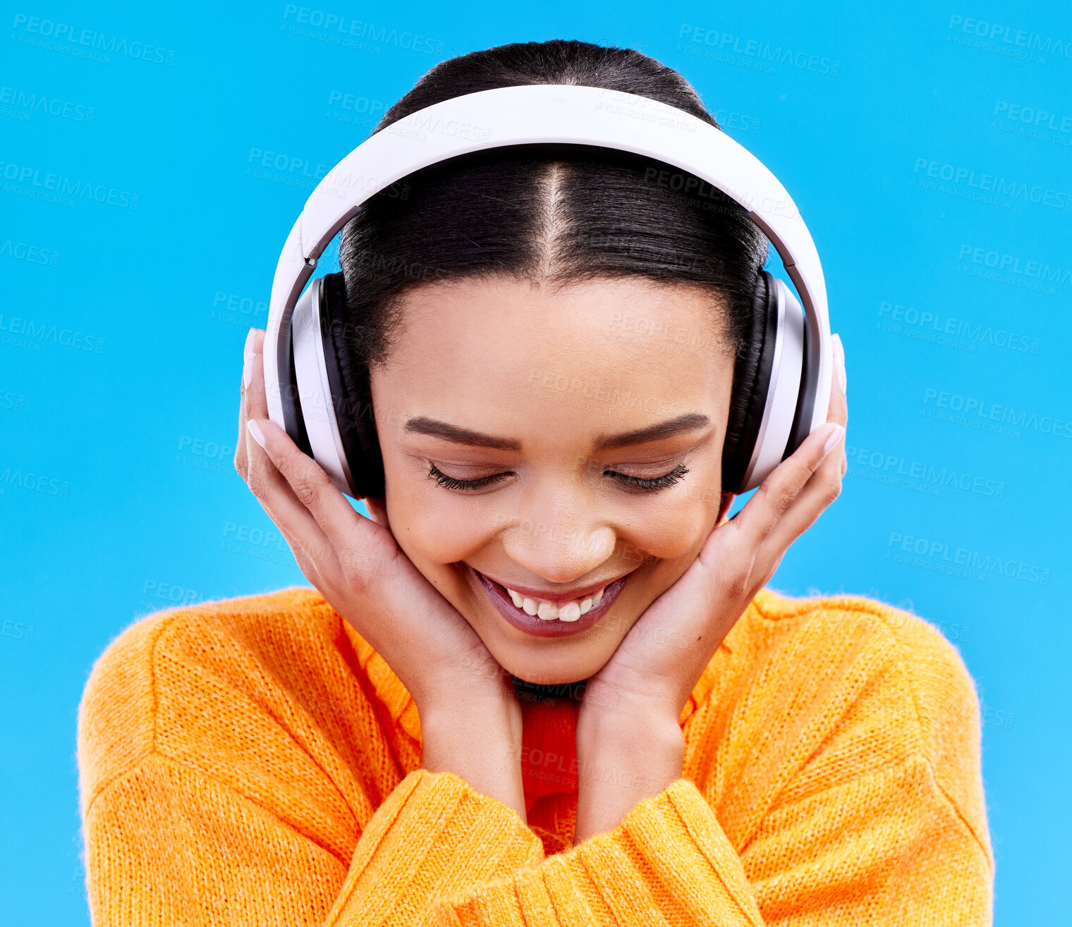 Buy stock photo Music headphones, woman and smile on blue background, studio and color backdrop. Happy female model listening to sound, streaming album and audio connection on media, gen z and hearing radio podcast