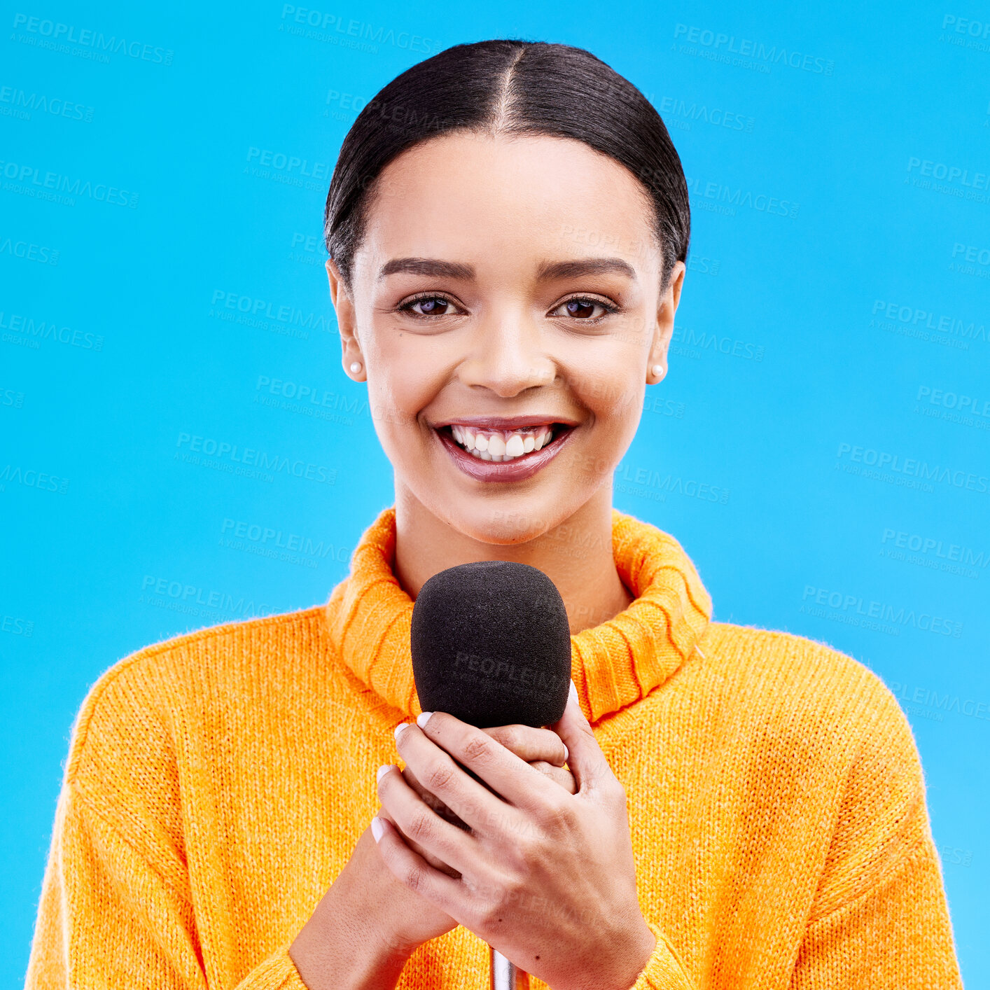 Buy stock photo Happy, microphone and portrait of woman in studio for singing, karaoke and journalist. Reporter, news announcement and media with female on blue background for information, interview or communication