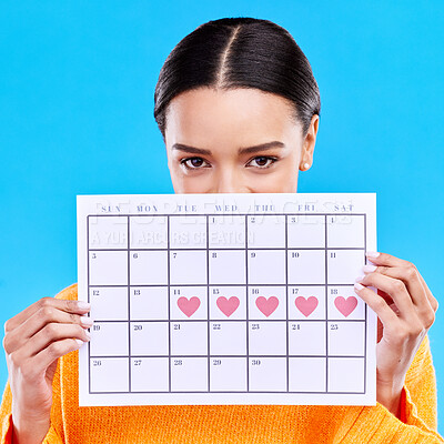 Buy stock photo Calendar, heart and woman on blue background for period schedule, planning and menstruation in studio. Time management, strategy and eyes of girl with month poster for date, weekly planner and cycle