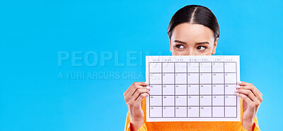 Buy stock photo Calendar, thinking and woman on blue background with poster for schedule, planning and agenda in studio. Time management, strategy and girl with month template for date, weekly planner and event