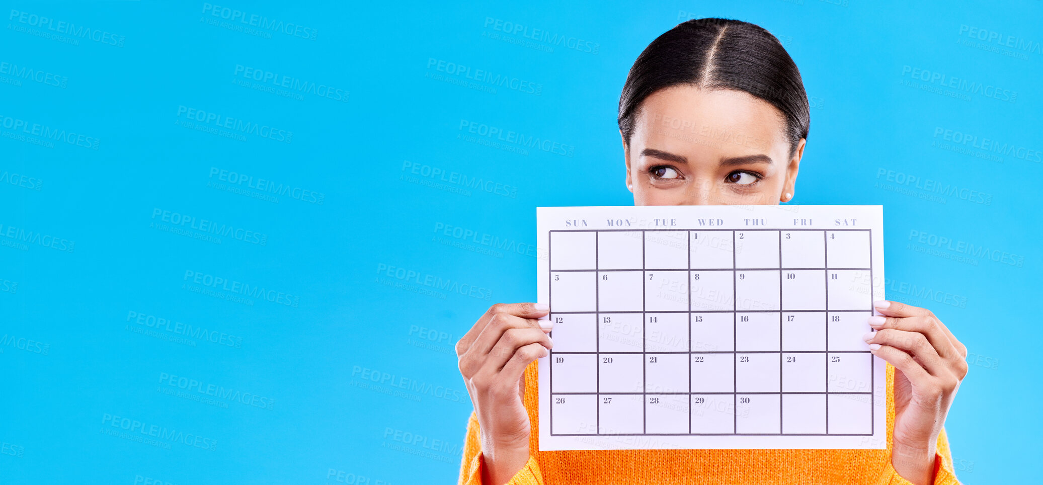 Buy stock photo Calendar, thinking and woman on blue background with poster for schedule, planning and agenda in studio. Time management, strategy and girl with month template for date, weekly planner and event