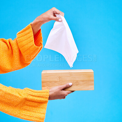 Buy stock photo Tissue, box and hands of woman on blue background for sinus, sickness and flu on blue background. Healthcare mockup, paper and girl with wipe, napkin and handkerchief for hygiene, allergy and sneeze