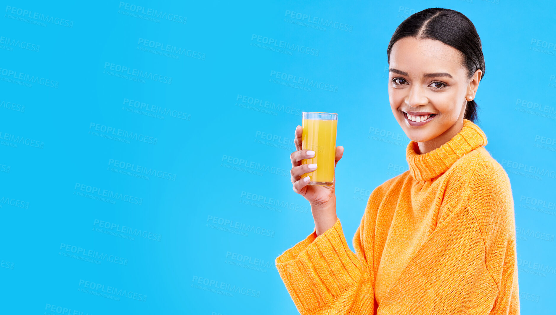 Buy stock photo Orange juice, happy and portrait of woman in studio and mockup for nutrition, health and diet. Vitamin c, fruit and fresh with female drinking on blue background for citrus, fiber or organic beverage