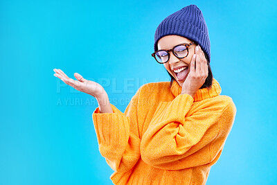 Buy stock photo Woman palm, happiness and portrait in a studio with promotion and announcement. Excited, isolated and blue background with mockup of a gen z girl and cool young female show marketing with smile