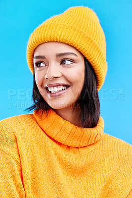 Buy stock photo Happiness, excited and woman with youth cap in studio ready for cold weather with winter hat. Isolated, blue background and smiling with a happy young and gen z person with a smile, beanie and joy
