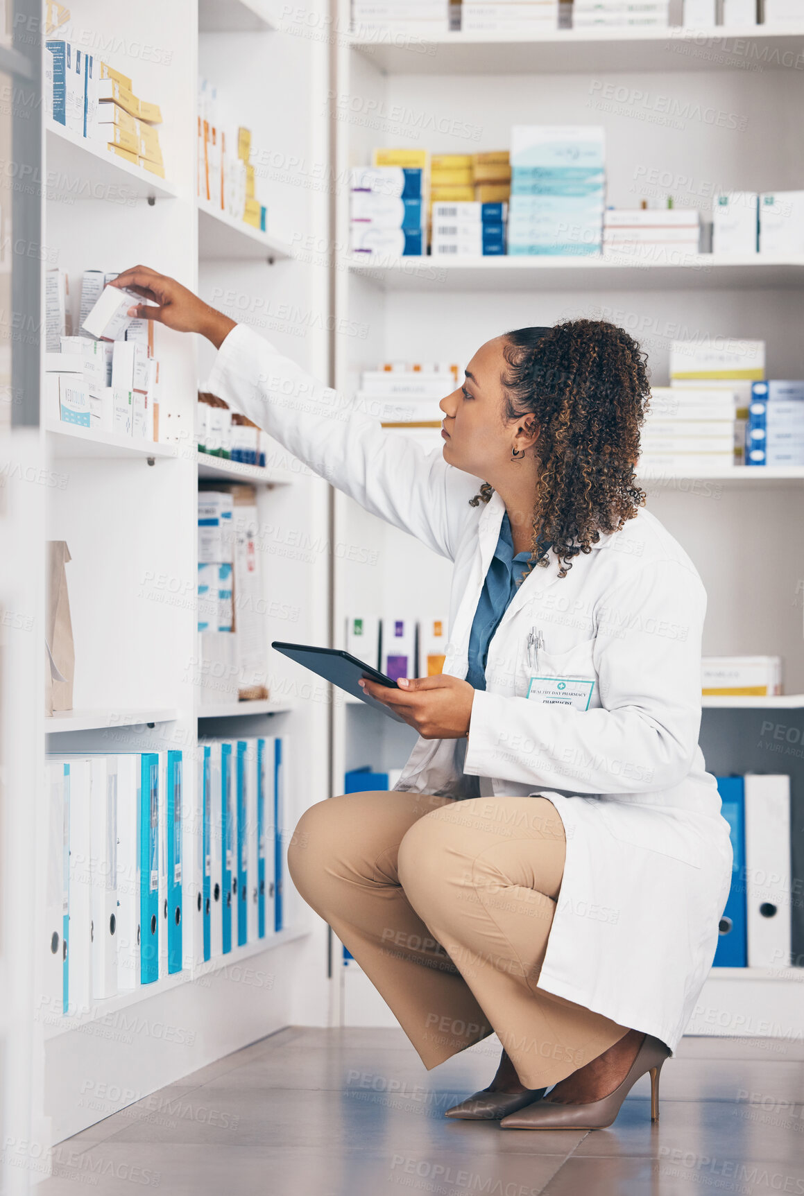 Buy stock photo Pharmacy, product and pharmacist woman on tablet for medicine management, stock research or inventory. Digital, logistics and retail or medical doctor, reading box or pharmaceutical quality assurance