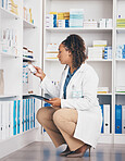 Tablet, stock and insurance with a pharmacist woman at work to fill an online order or prescription. Medical, product and healthcare with a female working as a medicine professional in a pharmacy