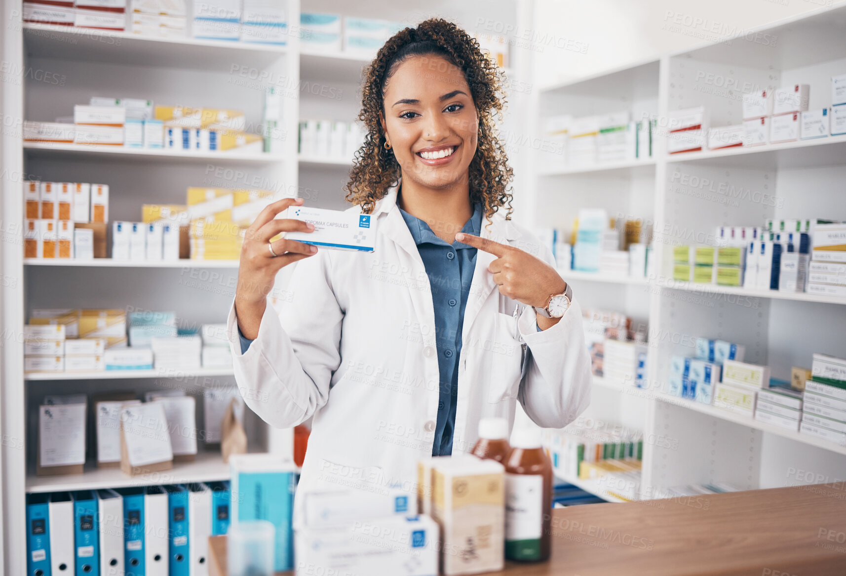 Buy stock photo Pointing, pharmacist or portrait of happy woman with medicine in customer services or wellness clinic. Healthcare help desk, pharmacy or doctor smiling to promote medication or pills on drugstore 