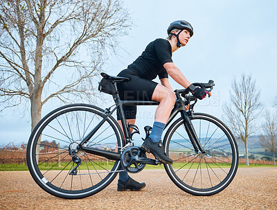 Buy stock photo Ready, cycling and fitness with woman in nature for training, workout and sports cardio. Health, relax and thinking with female cyclist riding on bike in outdoor for exercise, endurance and challenge