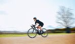 Cycling, speed and fitness with woman in nature and mockup for motion blur, workout and challenge. Exercise, workout and travel with female cyclist riding on bike for journey, adventure and cardio