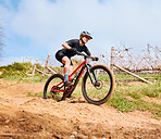 Bicycle, countryside road and woman on a bike with speed for sports race on gravel. Fitness, exercise and fast athlete doing sport training in nature on a park trail for cardio and healthy workout